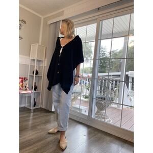 Katie Todd Women's Button Down Scarf. Knitted black pockets knitted cables wrap